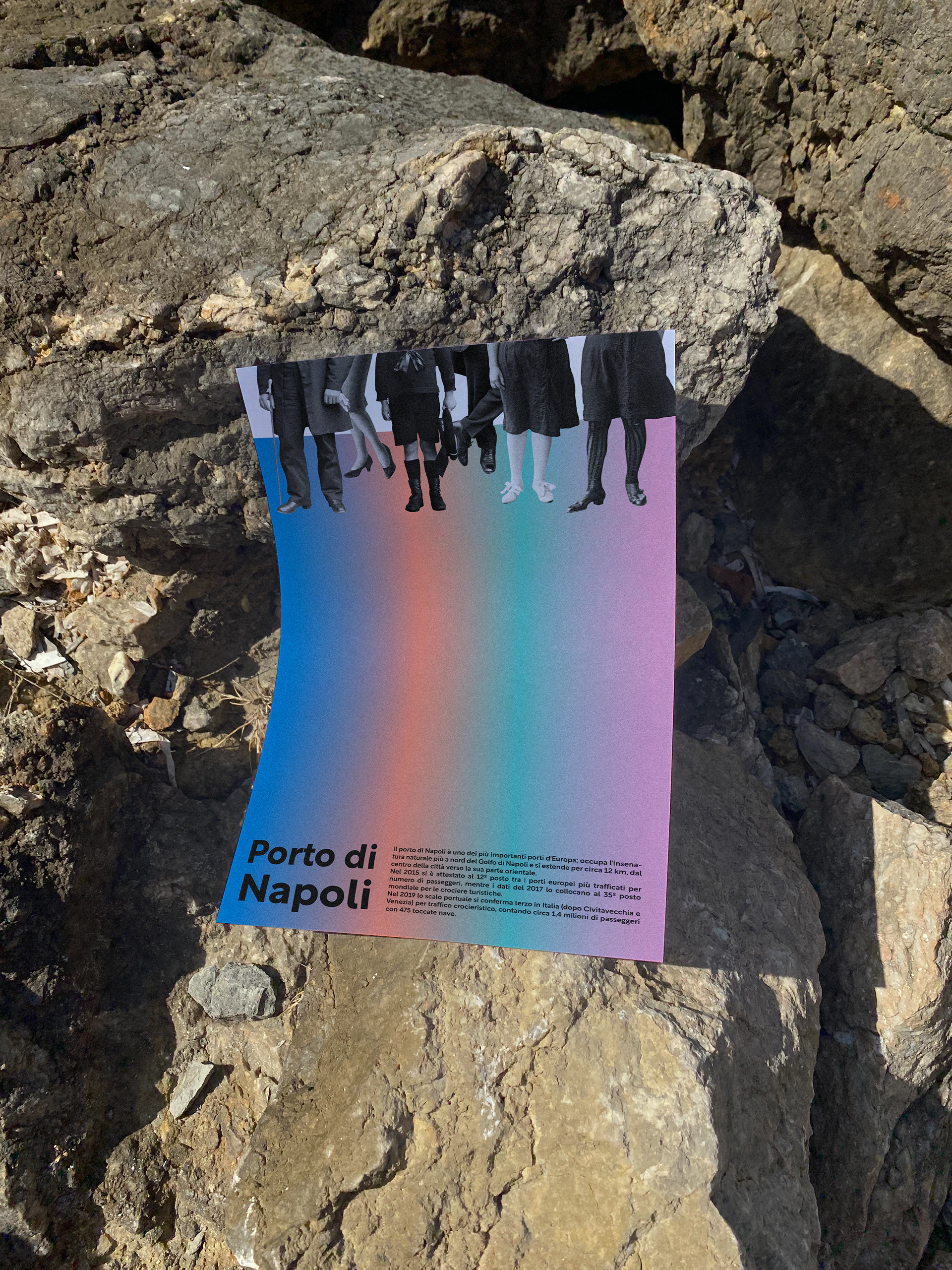 Another poster, in a coloured gradient, on a rock.