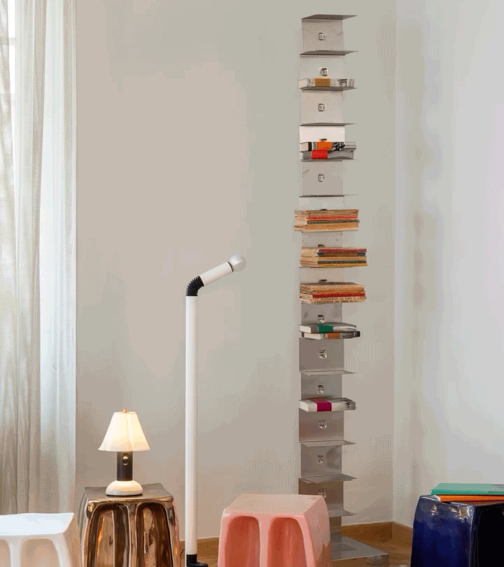 The TOTIMO website over a view of the showroom, with a lamp and a bookcase.