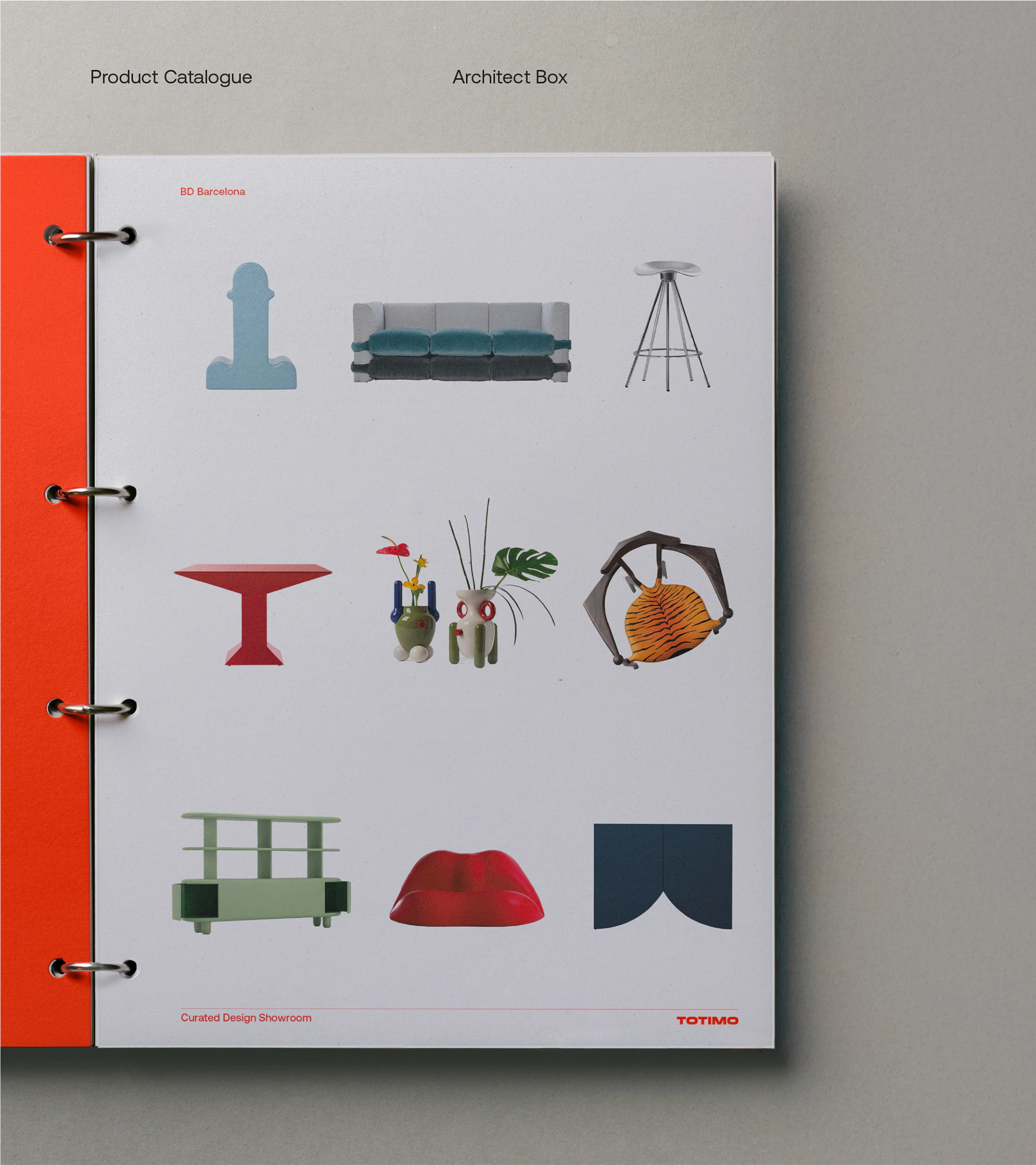 The TOTIMO product catalogue in a red ring binder.